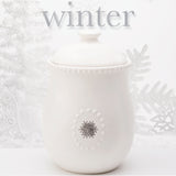 White Ceramic Canister w/Lid and  5 Interchangeable Metal Seasonal/Decor Magnets.